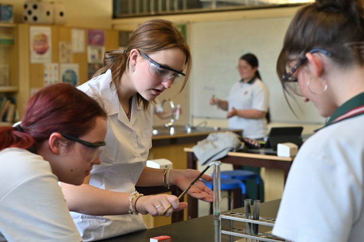 Students doing a science experiment in the science labs